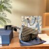 692f11ac4ecd253cf1078d9b Dior Saddle Bag for Men - A Cool and Stylish Twist on the Iconic Saddle Design
