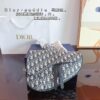 692f11bd4ecd253cf1078dba Dior Saddle Bag Homme - A Bold Statement in Streetwear Elegance