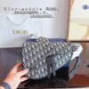 692f11c04ecd253cf1078dbf Dior Saddle Bag Homme - A Bold Statement in Streetwear Elegance