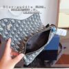 692f11c14ecd253cf1078dc1 Dior Saddle Bag Homme - A Bold Statement in Streetwear Elegance