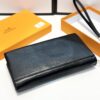 692f16e25464a31cf521a663 Hermès Black Leather Clutch - 21x10, Model 90095