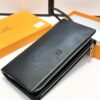 692f16e75464a31cf521a66a Hermès Black Leather Clutch - 21x10, Model 90095