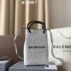 692fabcf99f2d84055c86514 Balenciaga Mini Tote Bag Limited Edition at Boutique, Featured by Entertainment Weekly - Stylish Black and White Design