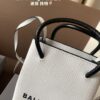 692fabd199f2d84055c86517 Balenciaga Mini Tote Bag Limited Edition at Boutique, Featured by Entertainment Weekly - Stylish Black and White Design