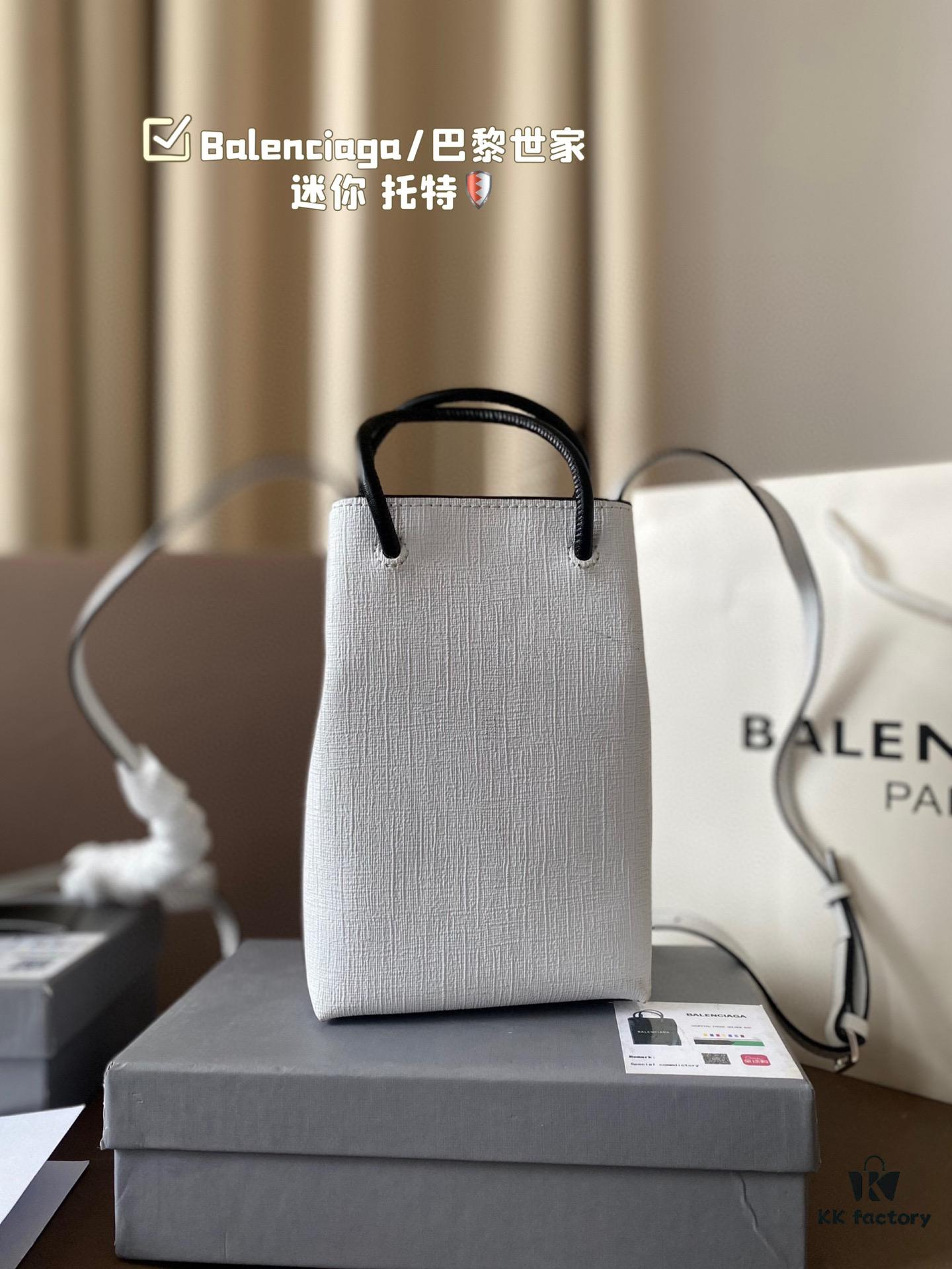 692fabd299f2d84055c86518 Balenciaga Mini Tote Bag Limited Edition at Boutique, Featured by Entertainment Weekly - Stylish Black and White Design