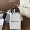 692fabd399f2d84055c8651a Balenciaga Mini Tote Bag Limited Edition at Boutique, Featured by Entertainment Weekly - Stylish Black and White Design