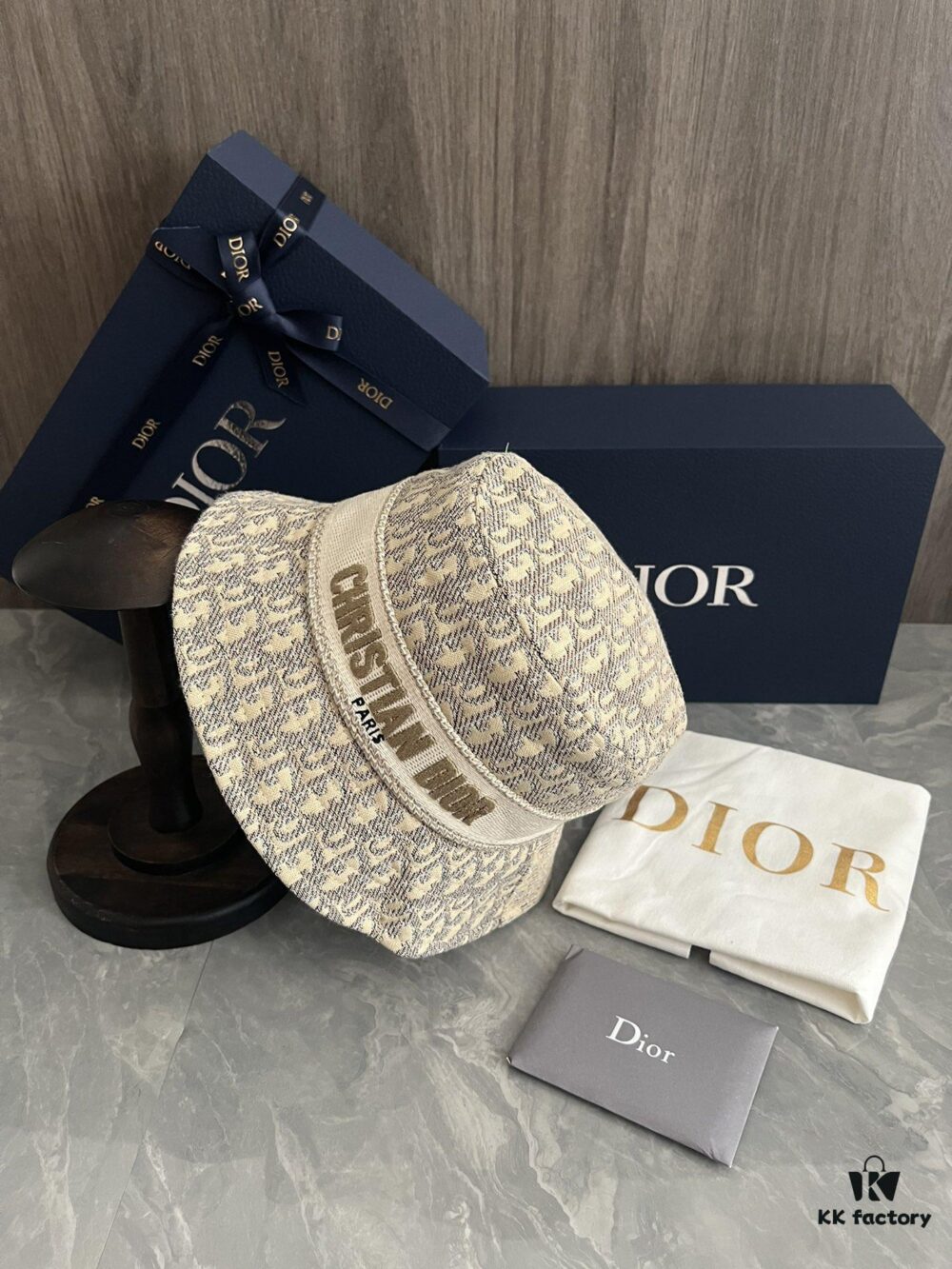 692fb1c599f2d84055c86f70 DIOR Bucket Hat, Ultra-Elegant with Deepened Silhouette Enhancing the Look, Featuring Contrasting Trim Embroidered with Bold 'Christian Dior Paris' Lettering