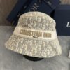 692fb1c599f2d84055c86f71 DIOR Bucket Hat, Ultra-Elegant with Deepened Silhouette Enhancing the Look, Featuring Contrasting Trim Embroidered with Bold 'Christian Dior Paris' Lettering