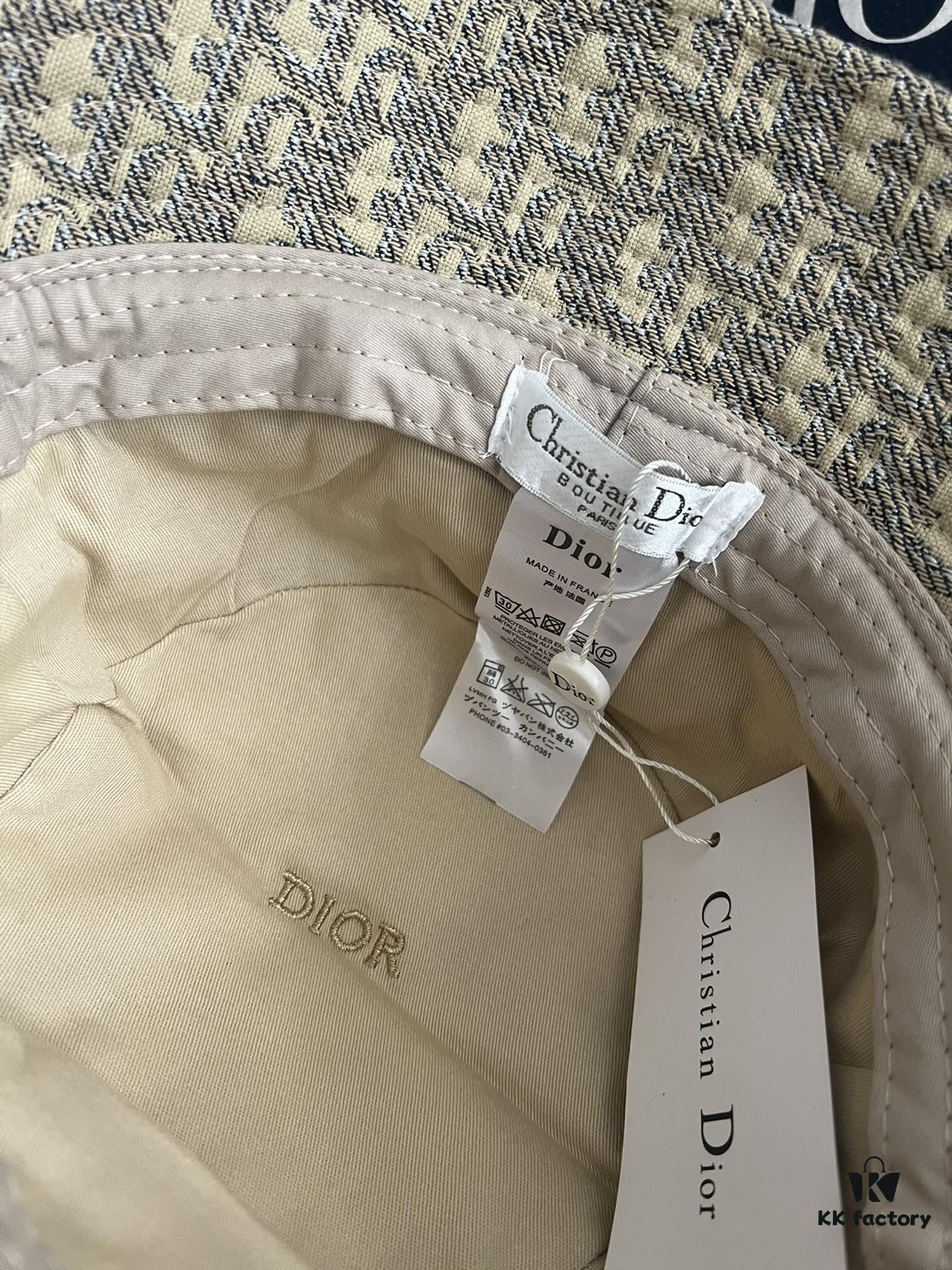 692fb1ca99f2d84055c86f73 DIOR Bucket Hat, Ultra-Elegant with Deepened Silhouette Enhancing the Look, Featuring Contrasting Trim Embroidered with Bold 'Christian Dior Paris' Lettering