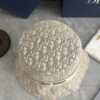 692fb1ca99f2d84055c86f74 DIOR Bucket Hat, Ultra-Elegant with Deepened Silhouette Enhancing the Look, Featuring Contrasting Trim Embroidered with Bold 'Christian Dior Paris' Lettering