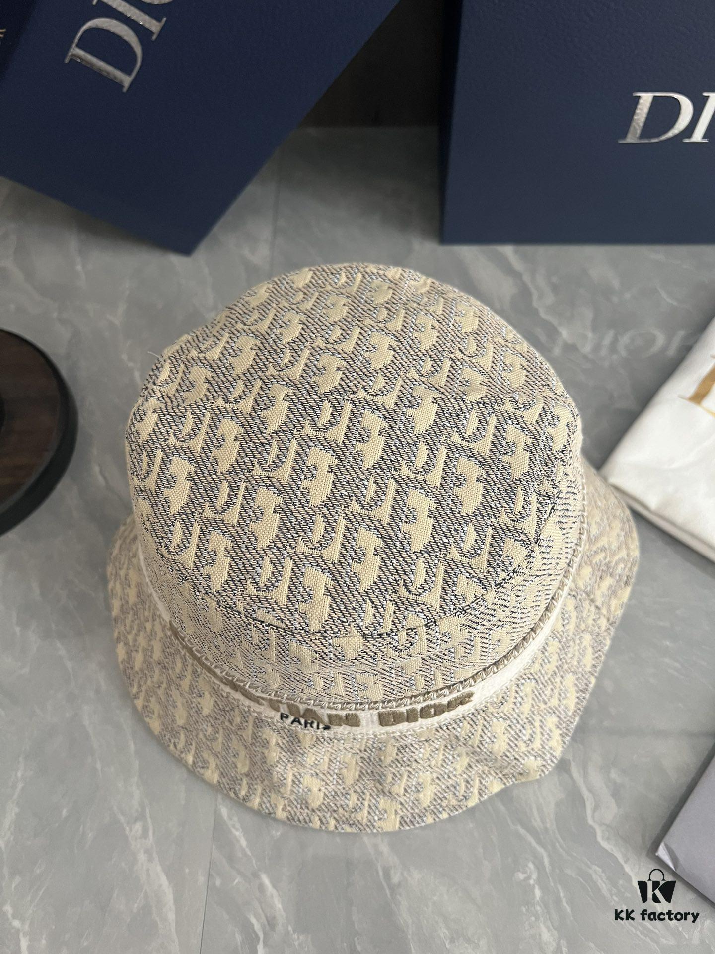 692fb1ca99f2d84055c86f74 DIOR Bucket Hat, Ultra-Elegant with Deepened Silhouette Enhancing the Look, Featuring Contrasting Trim Embroidered with Bold 'Christian Dior Paris' Lettering