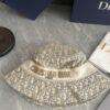 692fb1cb99f2d84055c86f76 DIOR Bucket Hat, Ultra-Elegant with Deepened Silhouette Enhancing the Look, Featuring Contrasting Trim Embroidered with Bold 'Christian Dior Paris' Lettering