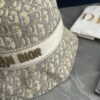 692fb1cb99f2d84055c86f77 DIOR Bucket Hat, Ultra-Elegant with Deepened Silhouette Enhancing the Look, Featuring Contrasting Trim Embroidered with Bold 'Christian Dior Paris' Lettering