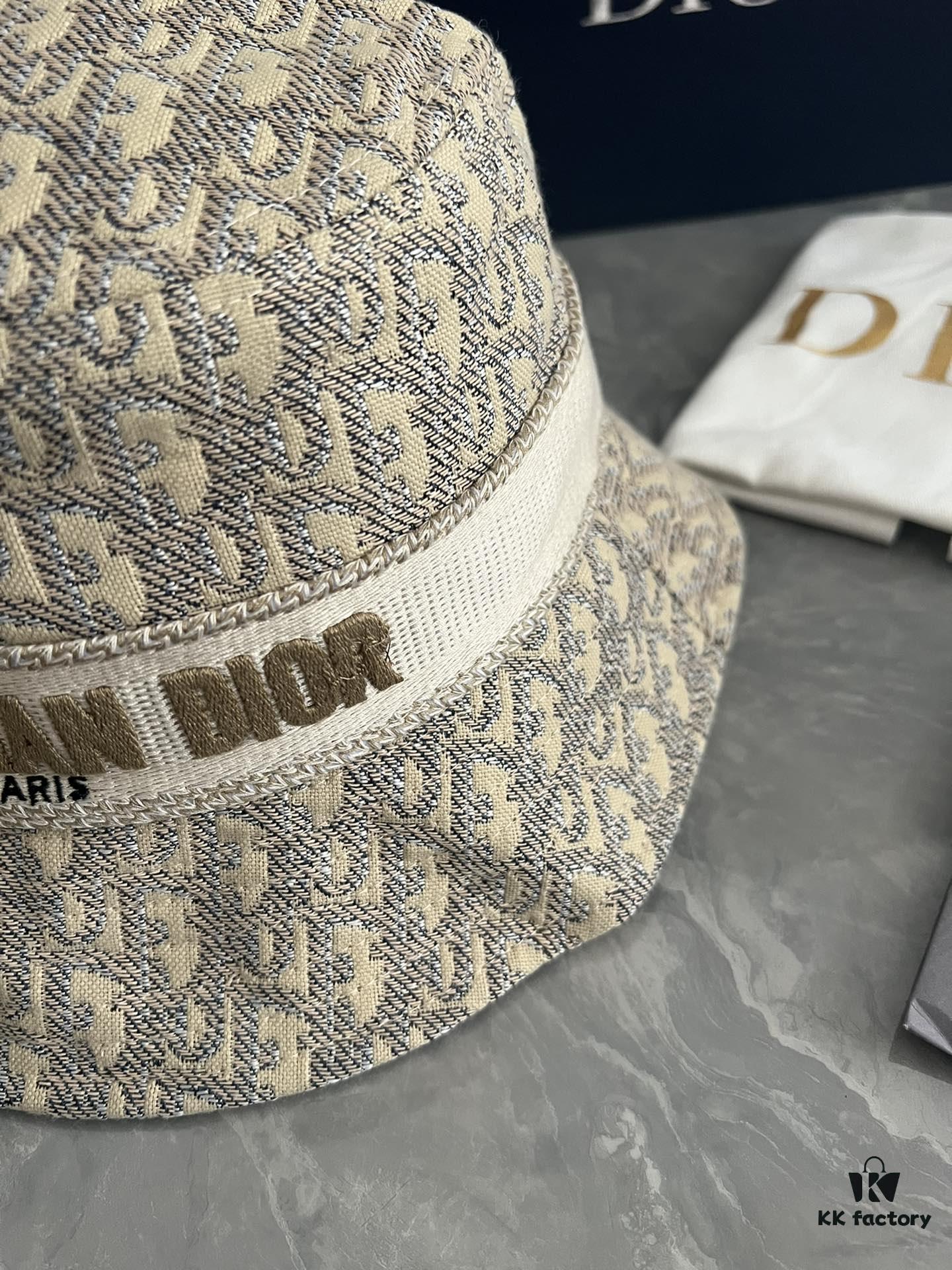 692fb1cb99f2d84055c86f77 DIOR Bucket Hat, Ultra-Elegant with Deepened Silhouette Enhancing the Look, Featuring Contrasting Trim Embroidered with Bold 'Christian Dior Paris' Lettering