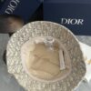 692fb1ce99f2d84055c86f7a DIOR Bucket Hat, Ultra-Elegant with Deepened Silhouette Enhancing the Look, Featuring Contrasting Trim Embroidered with Bold 'Christian Dior Paris' Lettering