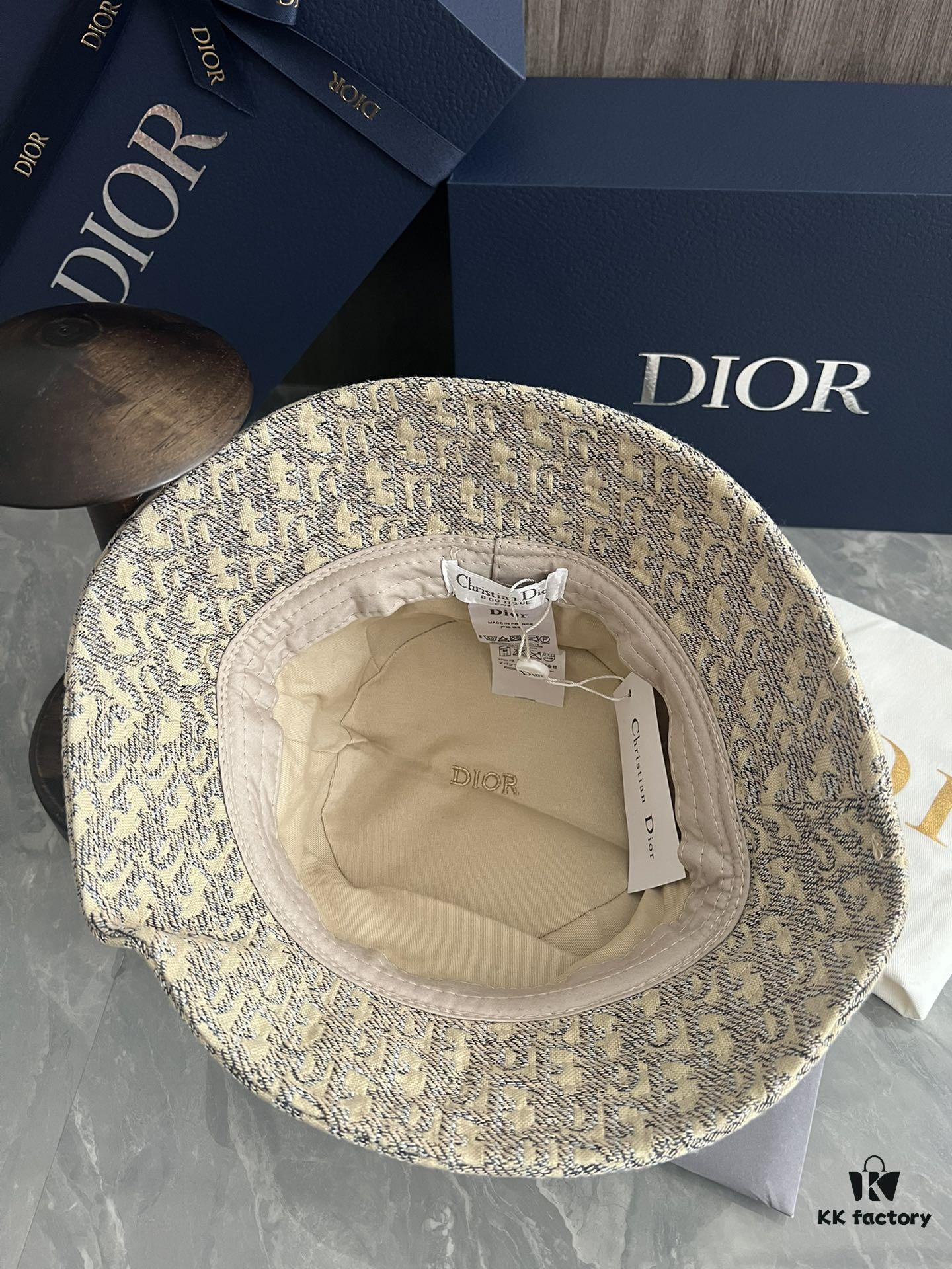 692fb1ce99f2d84055c86f7a DIOR Bucket Hat, Ultra-Elegant with Deepened Silhouette Enhancing the Look, Featuring Contrasting Trim Embroidered with Bold 'Christian Dior Paris' Lettering