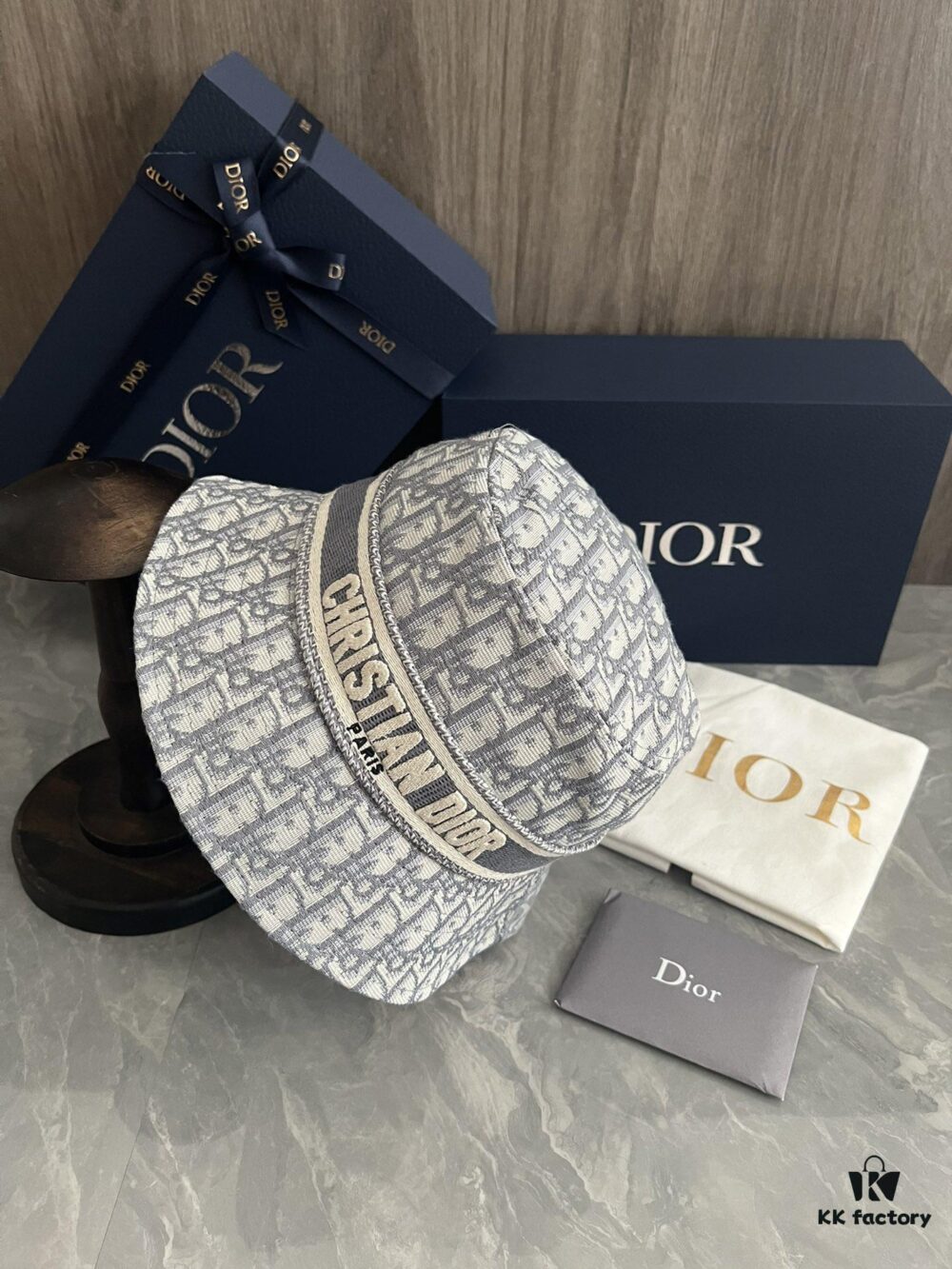 692fb1d199f2d84055c86f7f DIOR Bucket Hat for Men and Women, Deepened Design Exudes Elegance, Contrasting Trim with Bold 'Christian Dior Paris' Logo Embroidery
