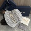 692fb1d199f2d84055c86f7f DIOR Bucket Hat for Men and Women, Deepened Design Exudes Elegance, Contrasting Trim with Bold 'Christian Dior Paris' Logo Embroidery