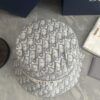 692fb1d699f2d84055c86f85 DIOR Bucket Hat for Men and Women, Deepened Design Exudes Elegance, Contrasting Trim with Bold 'Christian Dior Paris' Logo Embroidery