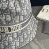 692fb1d699f2d84055c86f86 DIOR Bucket Hat for Men and Women, Deepened Design Exudes Elegance, Contrasting Trim with Bold 'Christian Dior Paris' Logo Embroidery