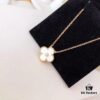 692fbea399f2d84055c87ef3 Red Carnelian / White Mother of Pearl / Black Onyx Van Cleef & Arpels Alhambra Clover Necklace, Sterling Silver with Thick Gold Plating
