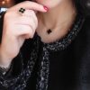 692fc0ce99f2d84055c8826a Clover Ring Inspired by Spring Rain, Featuring Yellow Gold Beaded Edge with Red Carnelian, Black Onyx, and White Mother-of-Pearl