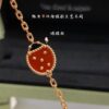 692fc16099f2d84055c8834c Lucky Spring Collection featuring ladybug and floral motifs, celebrating the rebirth of nature cherished by Van Cleef & Arpels. Crafted in rose gold, carnelian, and onyx, this collection enriches the Maison's enchanting connection with the natural world. Five meticulously handcrafted elements are delicately assembled into each piece. The chain is a specially customized thick design by Van Cleef & Arpels, with each link featuring eight faceted surfaces for enhanced sparkle. The tassel leaves are crafted with a crinkled foil texture for a refined, luxurious effect. The 'LG' engraving is discreetly placed on the side of the flower, while three totem stamps are embossed on the extension chain, and a serial code is engraved above the lobster clasp.