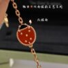 692fc16199f2d84055c8834d Lucky Spring Collection featuring ladybug and floral motifs, celebrating the rebirth of nature cherished by Van Cleef & Arpels. Crafted in rose gold, carnelian, and onyx, this collection enriches the Maison's enchanting connection with the natural world. Five meticulously handcrafted elements are delicately assembled into each piece. The chain is a specially customized thick design by Van Cleef & Arpels, with each link featuring eight faceted surfaces for enhanced sparkle. The tassel leaves are crafted with a crinkled foil texture for a refined, luxurious effect. The 'LG' engraving is discreetly placed on the side of the flower, while three totem stamps are embossed on the extension chain, and a serial code is engraved above the lobster clasp.