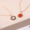 692fc40099f2d84055c88755 Bvlgari Double-Sided Pendant Necklace with Natural Stone – One Side Red Agate, One Side White Mother-of-Pearl