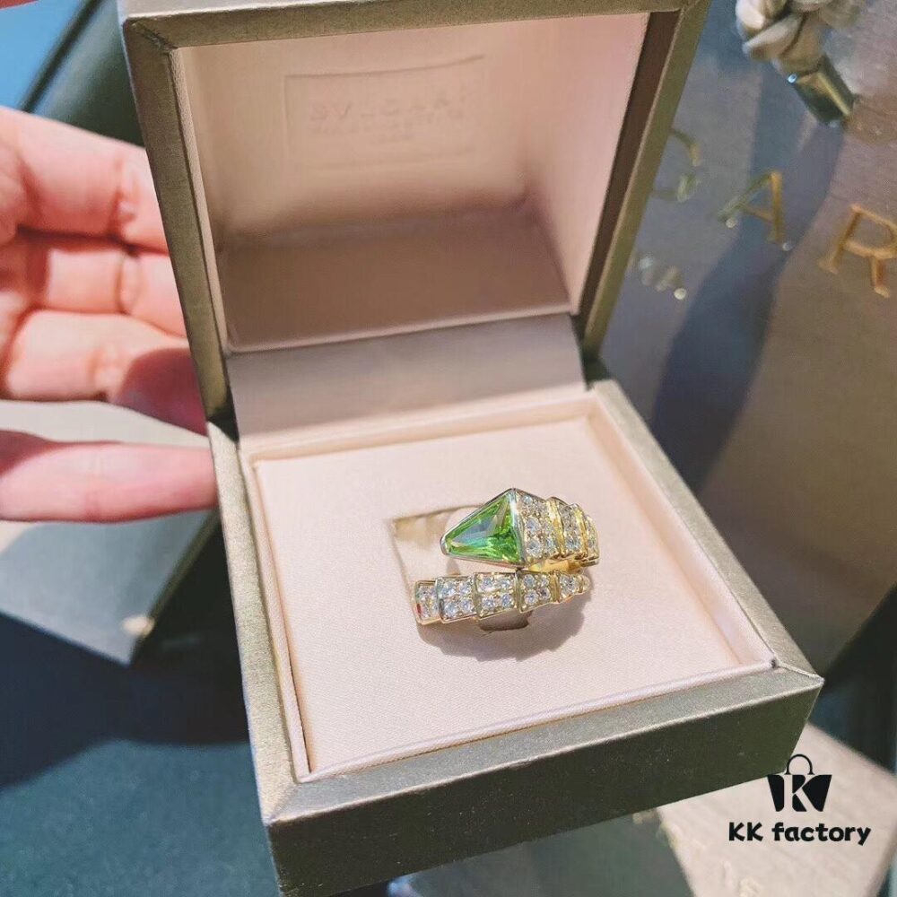 692fc50a99f2d84055c8891f Bvlgari Snake Ring with Peridot - A Luxurious and Fresh Statement Piece