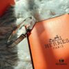 692fc83999f2d84055c88ed2 Hermes Titanium Steel with Natural White Shell Narrow Bracelet - Classic Design