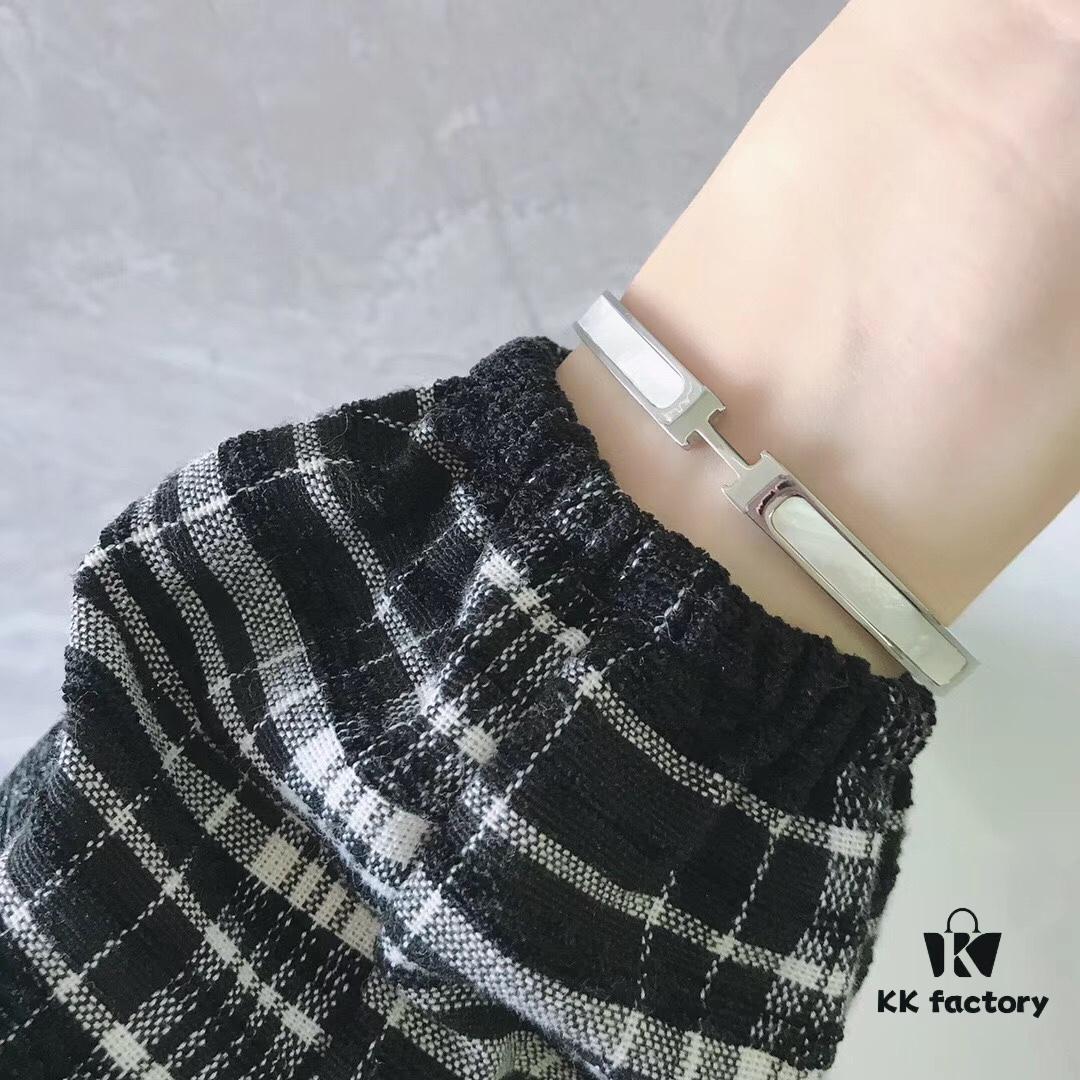 692fc83999f2d84055c88ed3 Hermes Titanium Steel with Natural White Shell Narrow Bracelet - Classic Design