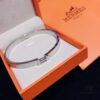 692fc83b99f2d84055c88ed6 Hermes Titanium Steel with Natural White Shell Narrow Bracelet - Classic Design