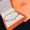 692fc83c99f2d84055c88ed7 Hermes Titanium Steel with Natural White Shell Narrow Bracelet - Classic Design