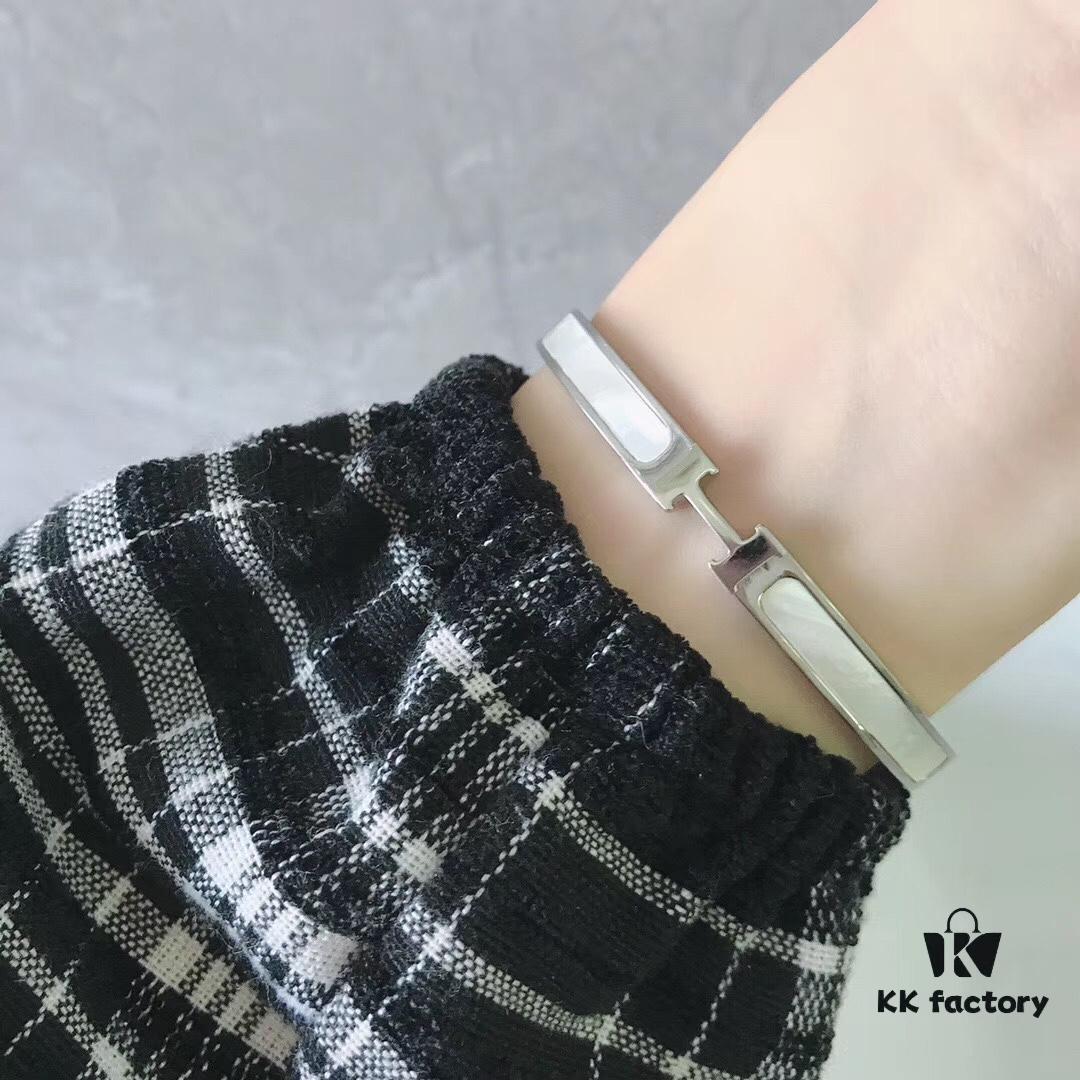 692fc84399f2d84055c88ee7 Hermes Titanium Steel with Natural White Shell Narrow Bracelet - Classic Design