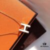 692fc84c99f2d84055c88ef7 Hermès Enamel Curved H Necklace in Gold Tones
