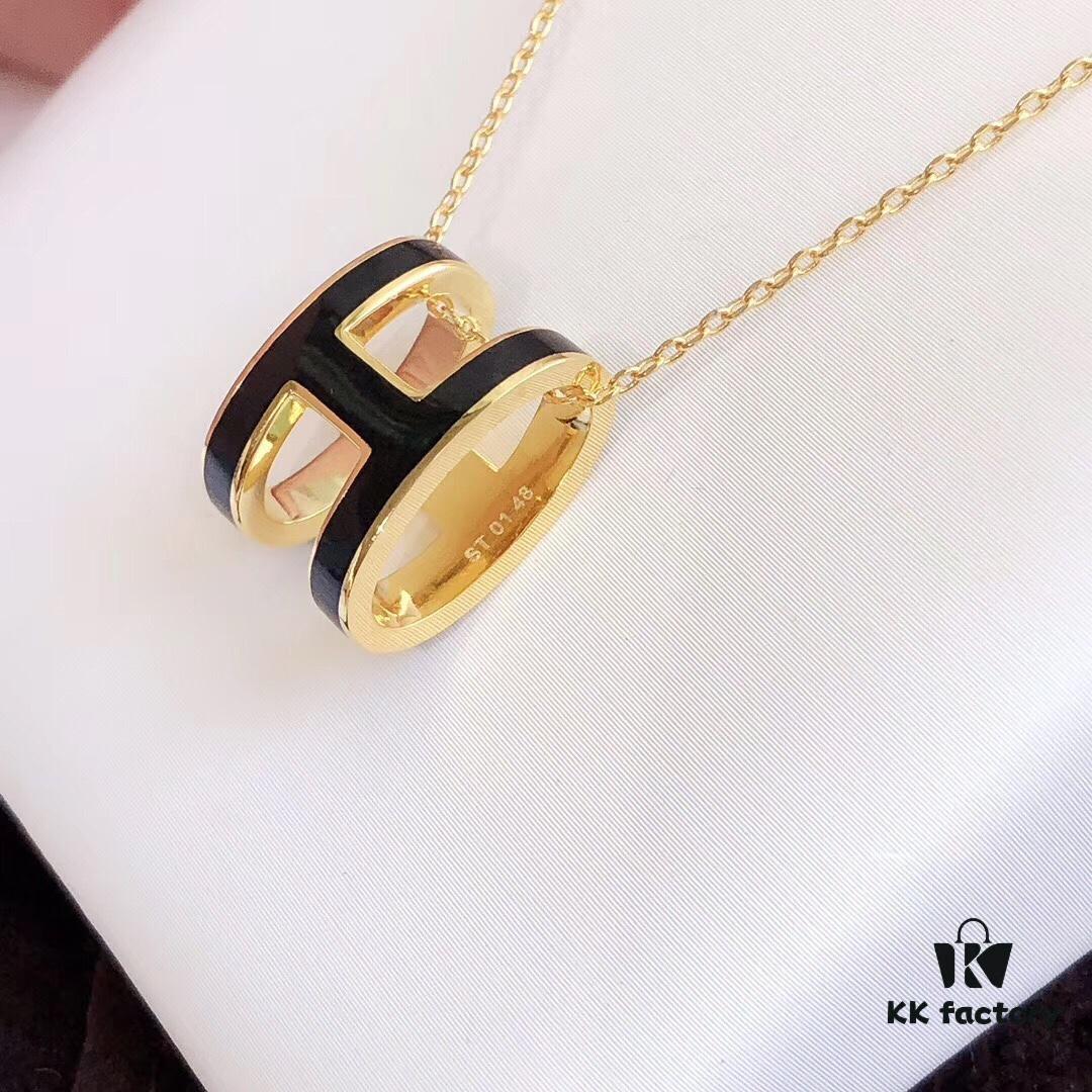 692fc84d99f2d84055c88ef9 Hermès Enamel Curved H Necklace in Gold Tones