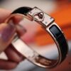 692fcad299f2d84055c8933c New Arrival Hermès-Inspired Enamel Cuff Bracelet with H Lock Closure