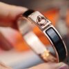 692fcad399f2d84055c8933d New Arrival Hermès-Inspired Enamel Cuff Bracelet with H Lock Closure