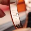 692fcad399f2d84055c8933f New Arrival Hermès-Inspired Enamel Cuff Bracelet with H Lock Closure