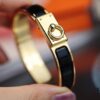 692fcad599f2d84055c89343 New Arrival Hermes-Inspired Enamel Bracelet with H Lock Closure