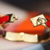 692fcadd99f2d84055c89353 New Arrival Hermes-Inspired Enamel Bangle Bracelet with H Lock Design