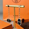 692fcbc599f2d84055c89508 Hermes Chaine d'Ancre Verso Asymmetric Pig Nose Earrings in Yellow Gold, Rose Gold, and Black Ceramic