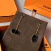 692fcbc599f2d84055c8950a Hermes Chaine d'Ancre Verso Asymmetric Pig Nose Earrings in Yellow Gold, Rose Gold, and Black Ceramic