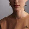 692fcbc799f2d84055c8950d Hermes Chaine d'Ancre Verso Asymmetric Pig Nose Earrings in Yellow Gold, Rose Gold, and Black Ceramic