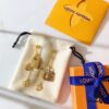692fcc9c99f2d84055c896ae Louis Vuitton Boite Chapeau Bag in Monogram Canvas and Gold-Tone Metal, Adorning Mini LV Asymmetrical Earrings