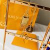 692fcc9c99f2d84055c896af Louis Vuitton Boite Chapeau Bag in Monogram Canvas and Gold-Tone Metal, Adorning Mini LV Asymmetrical Earrings