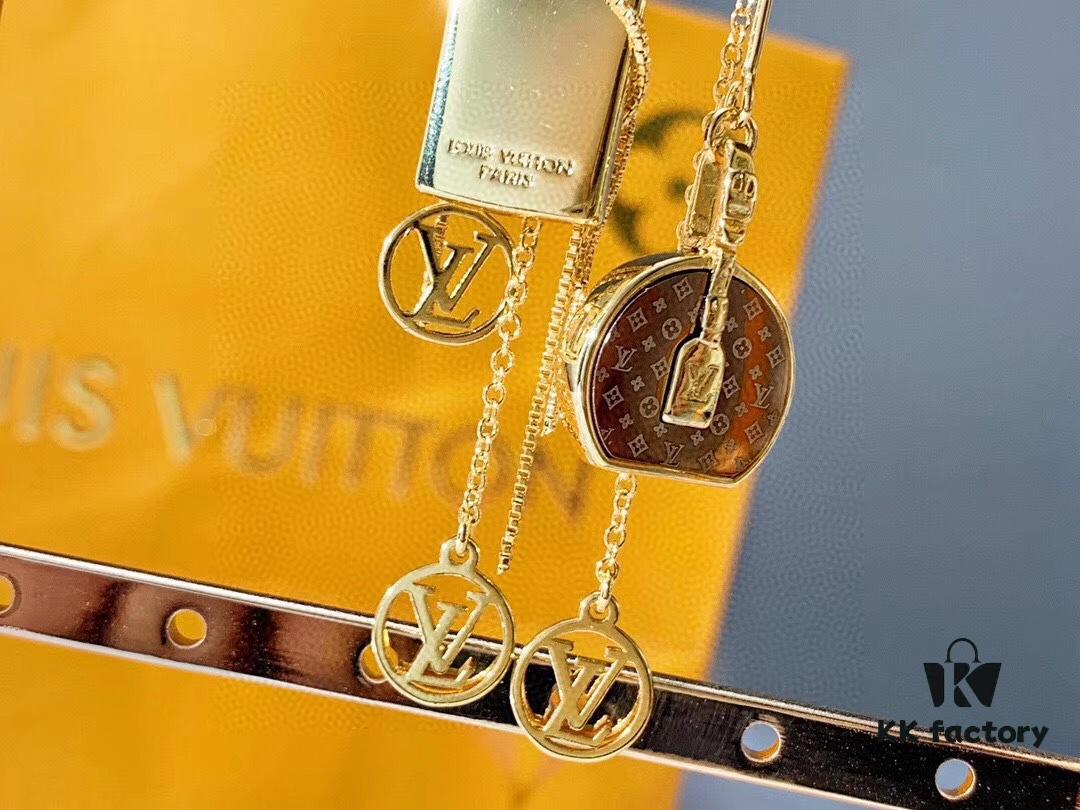 692fcc9d99f2d84055c896b1 Louis Vuitton Boite Chapeau Bag in Monogram Canvas and Gold-Tone Metal, Adorning Mini LV Asymmetrical Earrings