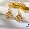 692fcc9e99f2d84055c896b3 Louis Vuitton Boite Chapeau Bag in Monogram Canvas and Gold-Tone Metal, Adorning Mini LV Asymmetrical Earrings
