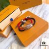 692fccaa99f2d84055c896cc Louis Vuitton LV Monogram Leather Bracelet - Premium Replica, Authentic Brass Hardware, Adjustable Calfskin Interior, Four Classic Patterns, Unisex Design